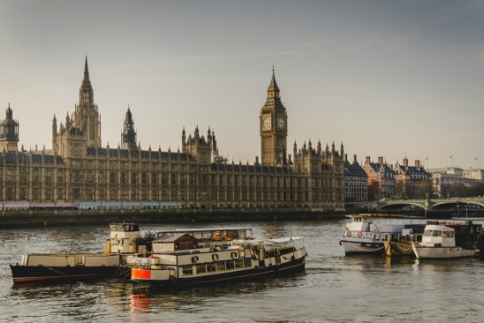 A photograph of the houses of parliament, indicative of government and the public sector in the UK